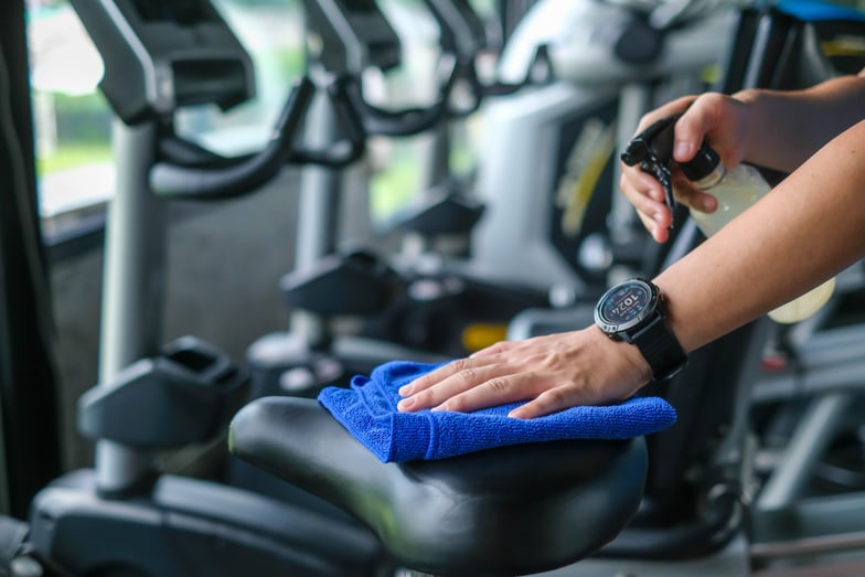 Gym etiquette wiping down equipment